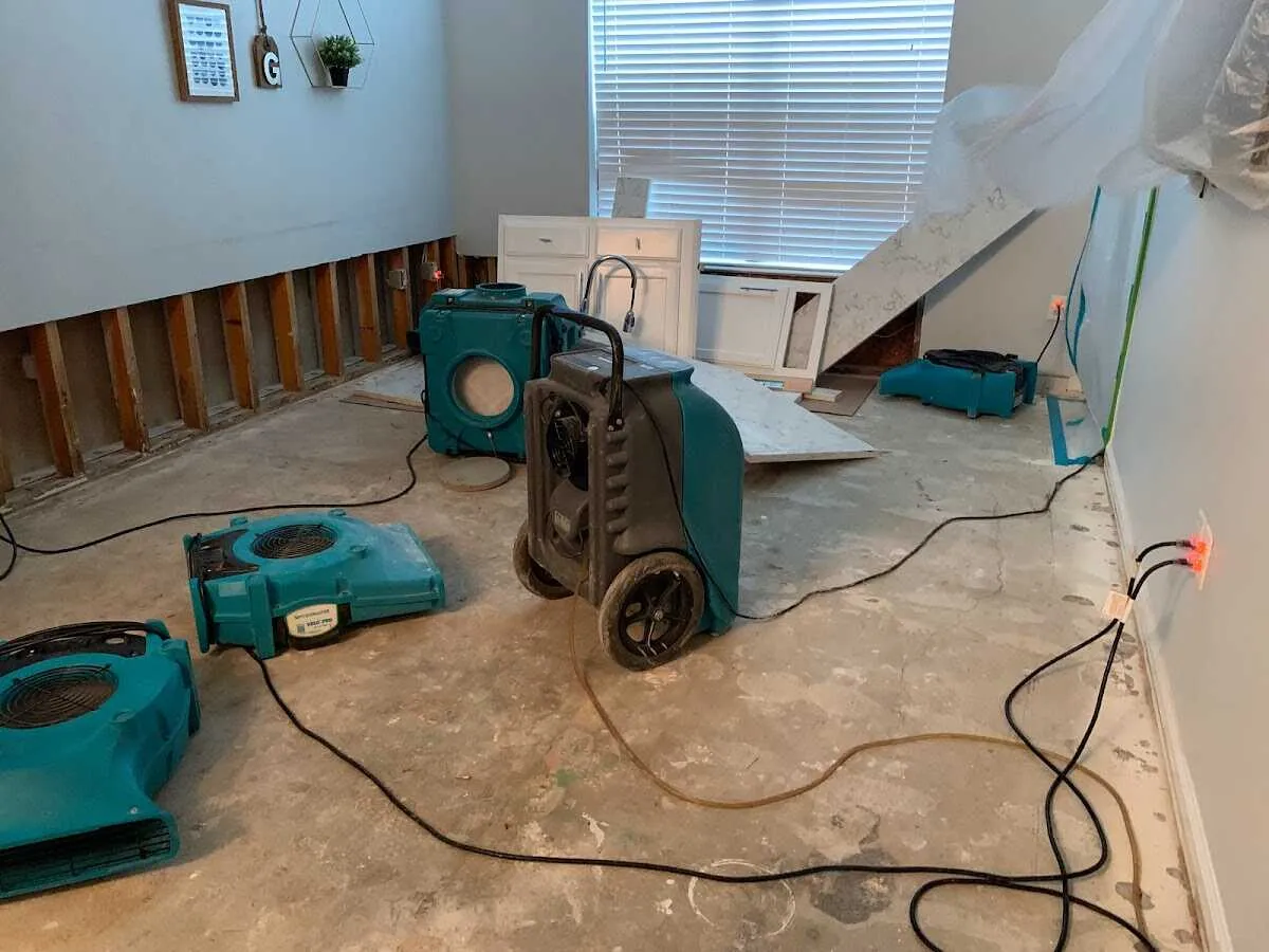Dehumidifier in flood-cut room for Water Damage Restoration in Oak Grove